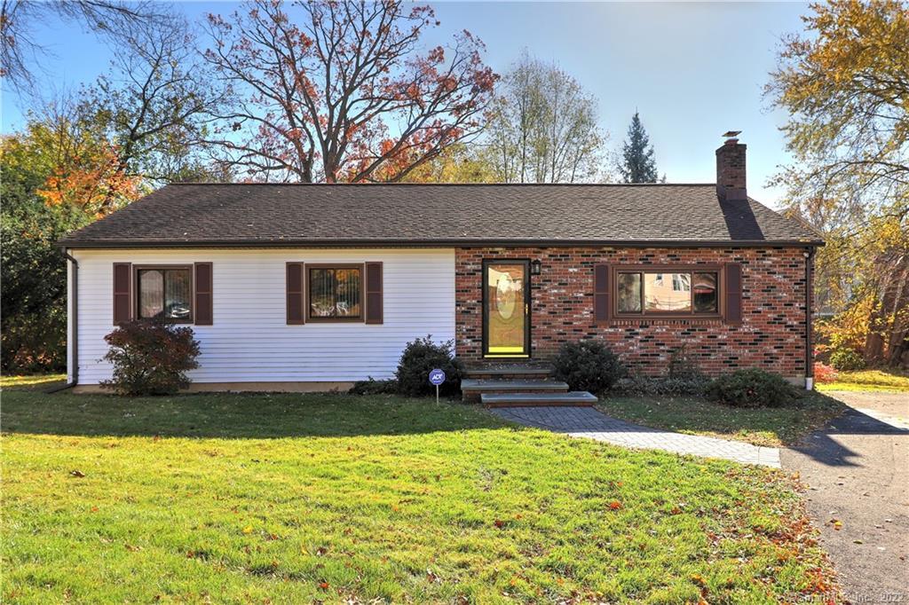 673 Milford Point Road Milford, CT 06460 - Photo 1 of 1 a front view of a house with a yard