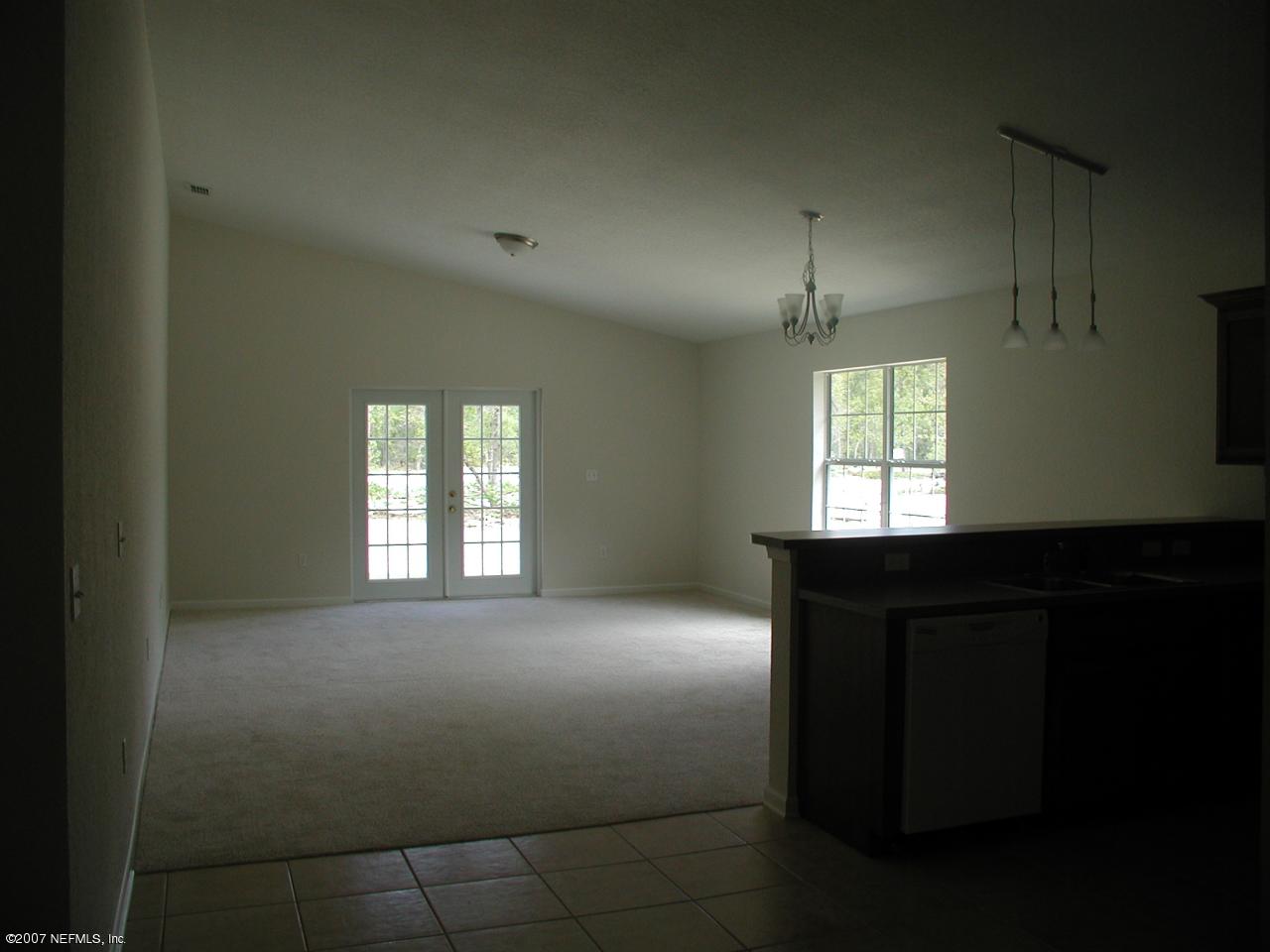4000 Bronco Road Middleburg, FL 32068 - Photo 4 of 13 a bedroom with a bed and a window