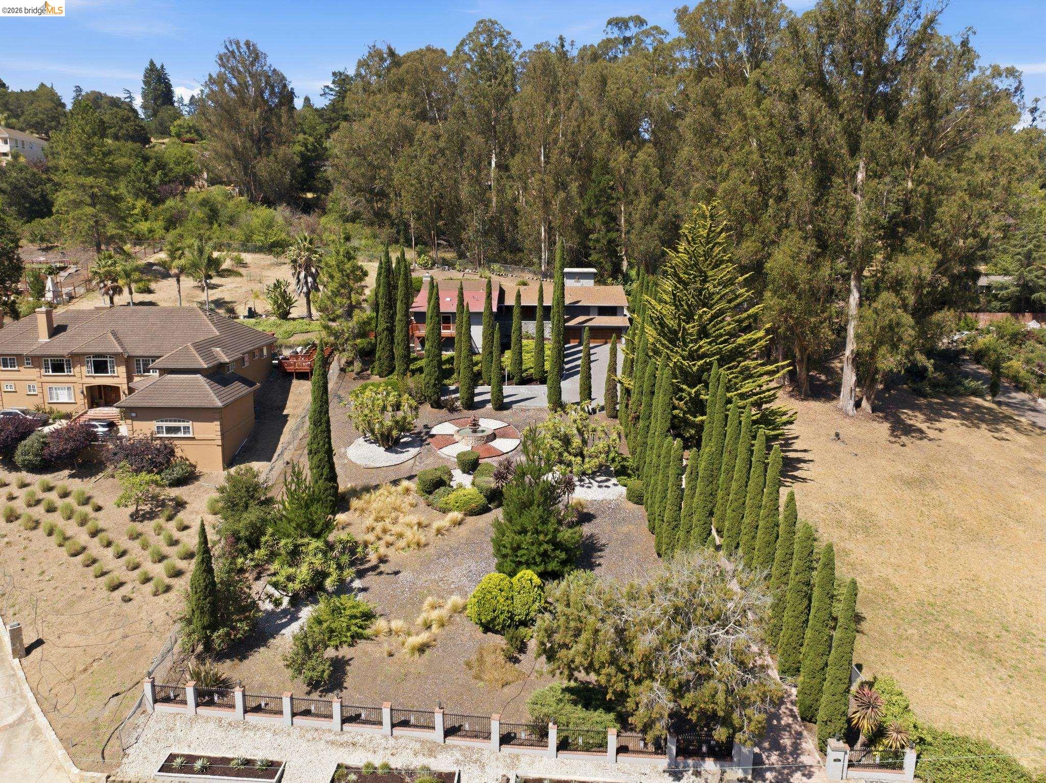 11133 Golf Links Road Oakland, CA 94605 - Photo 54 of 57 Terraced property featuring diverse landscaping and mature trees