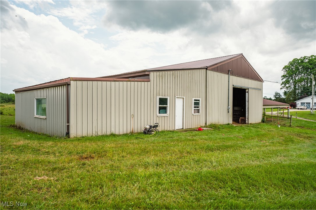 8200 Autumn Road Southwest Bowerston, OH 44695 - Photo 10 of 30 View of pole building with a yard