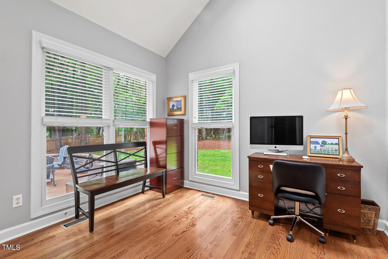 9900 2 Robins Court Raleigh, NC 27613 - Photo 37 of 83 a view of a workspace with furniture and a window