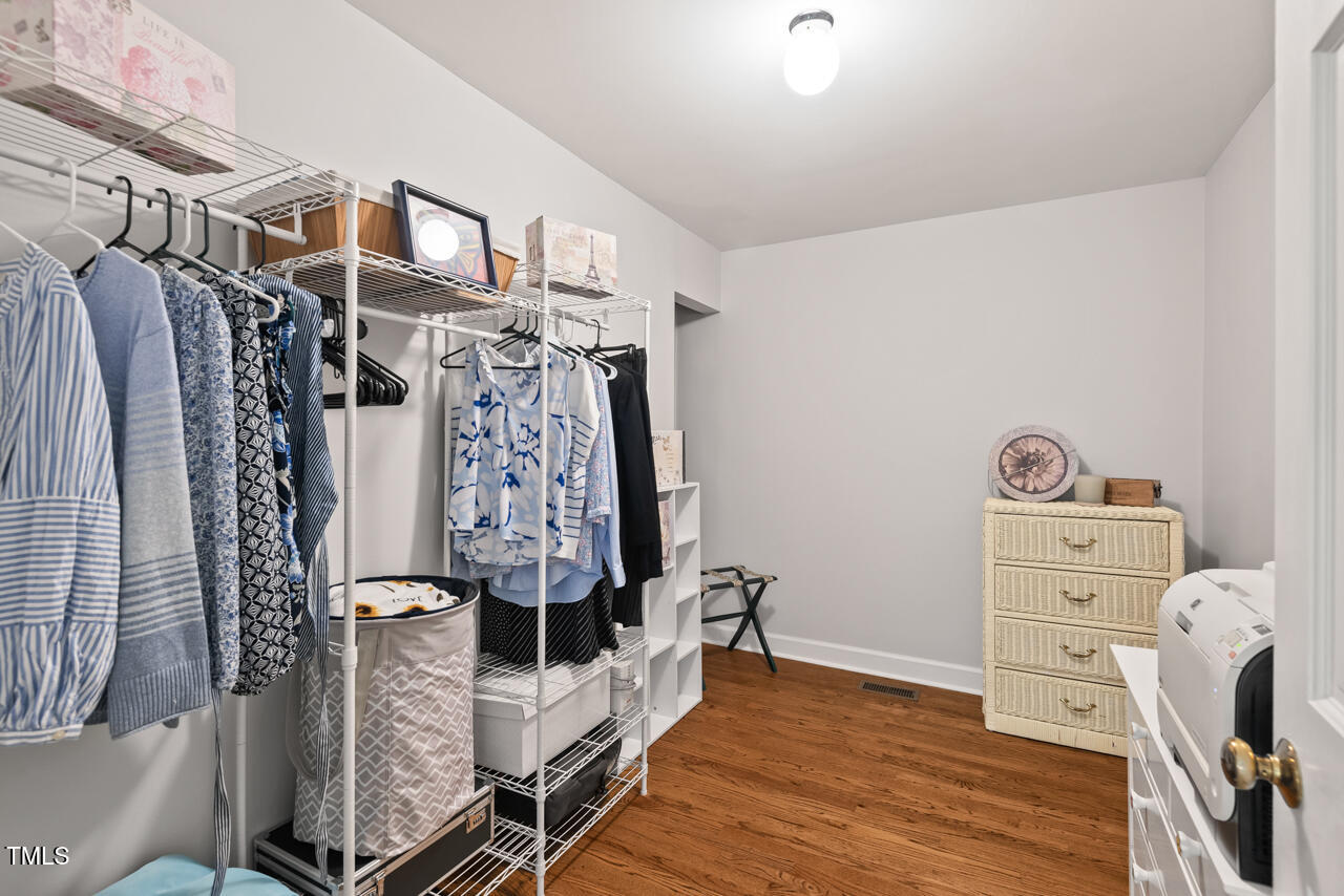 9900 2 Robins Court Raleigh, NC 27613 - Photo 44 of 83 a view of walk in closet with clothes and shoes