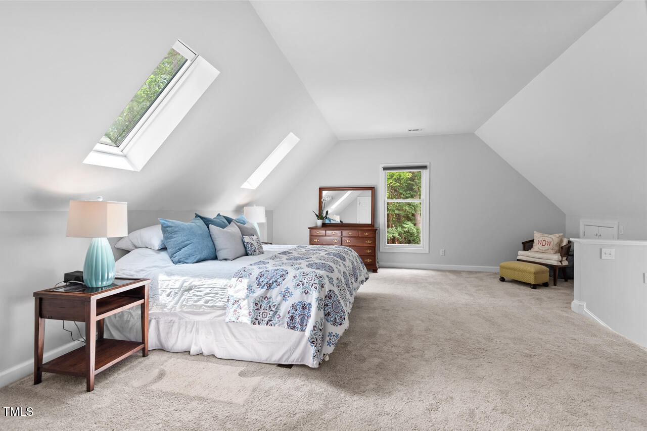 9900 2 Robins Court Raleigh, NC 27613 - Photo 47 of 83 a bedroom with a bed and a window