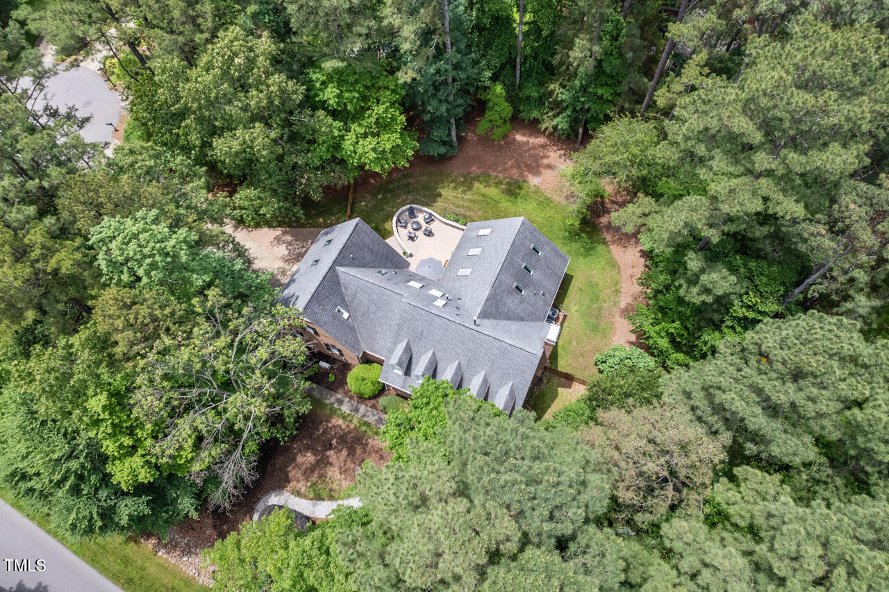 9900 2 Robins Court Raleigh, NC 27613 - Photo 5 of 83 an aerial view of a house with a yard and a large tree