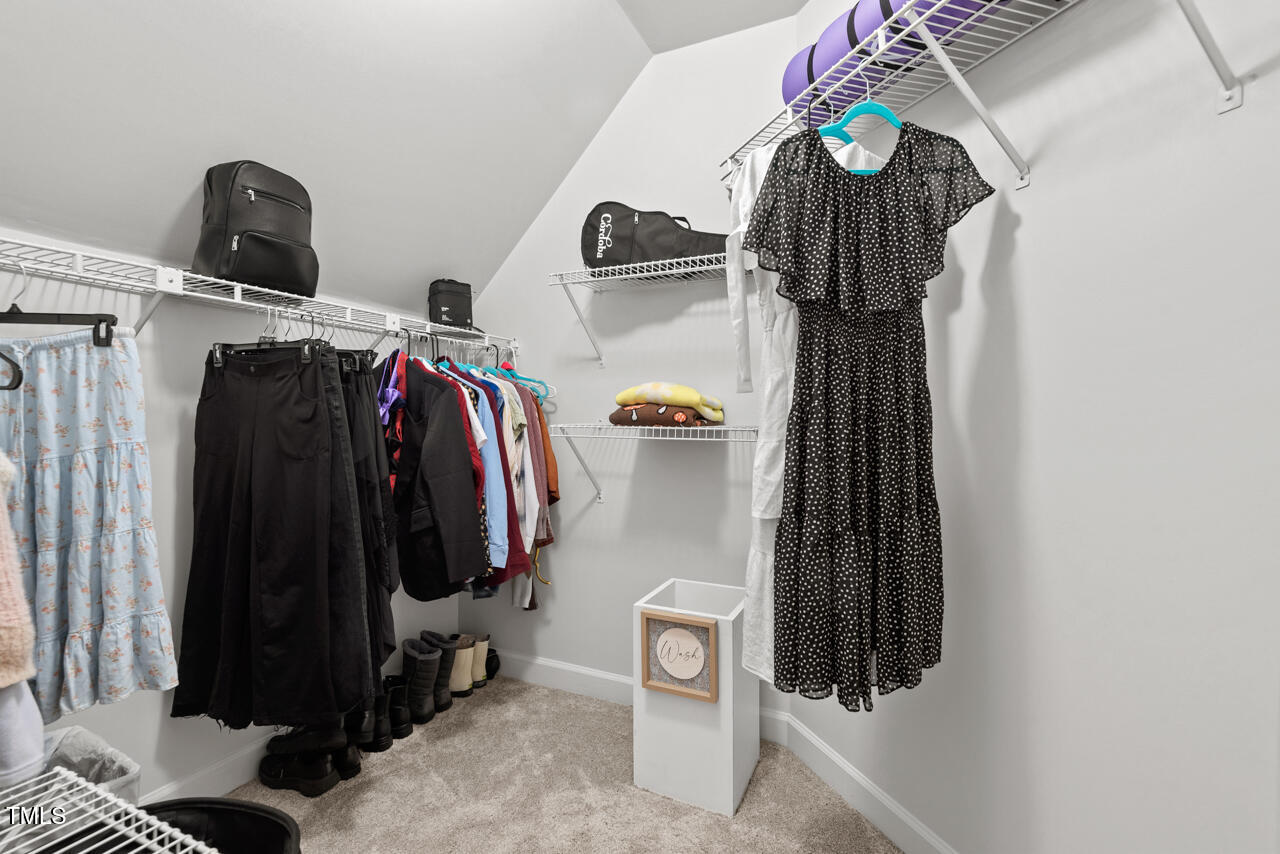 9900 2 Robins Court Raleigh, NC 27613 - Photo 66 of 83 a view of walk in closet with clothes and shoes