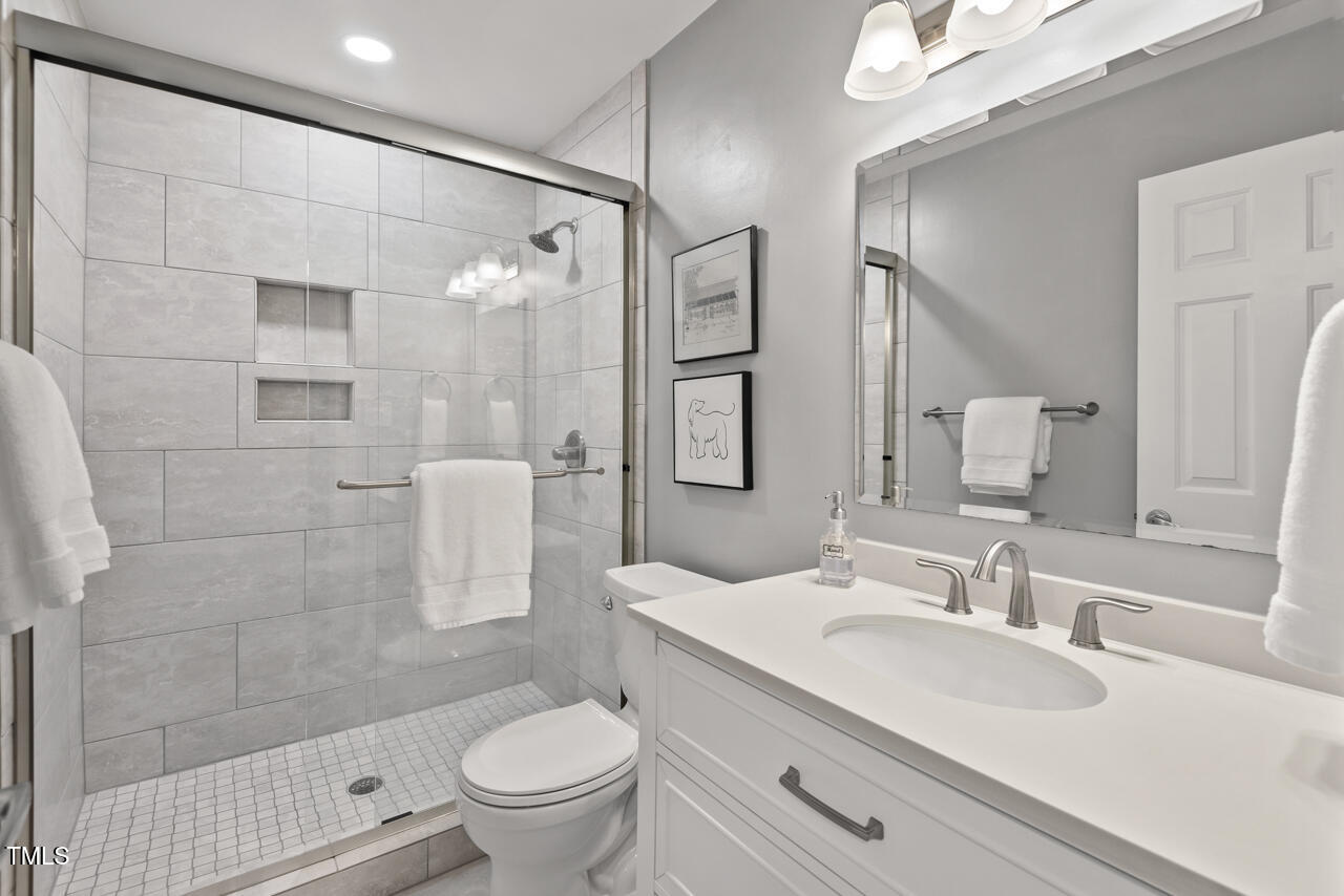 9900 2 Robins Court Raleigh, NC 27613 - Photo 67 of 83 a bathroom with a sink toilet and shower