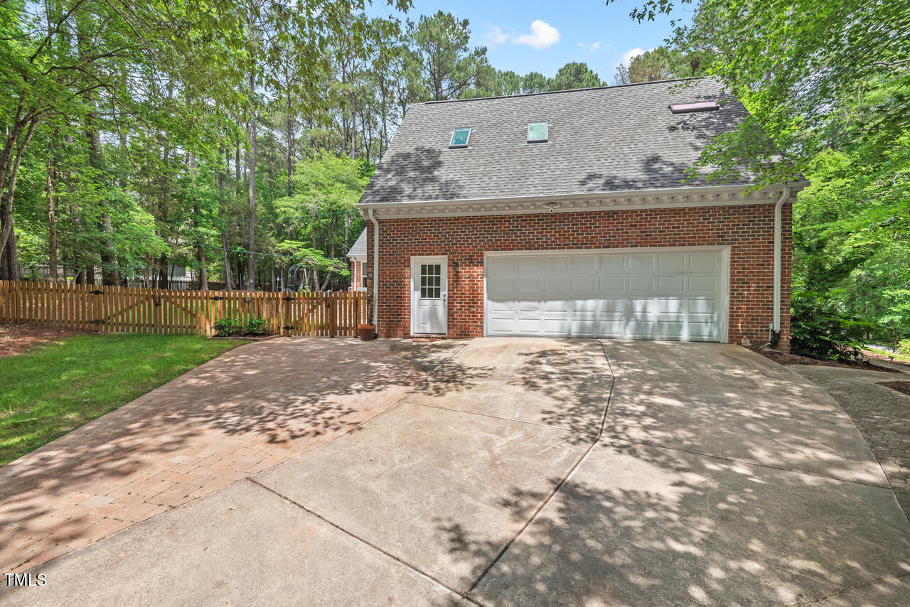 9900 2 Robins Court Raleigh, NC 27613 - Photo 71 of 83 front view of a house with a yard