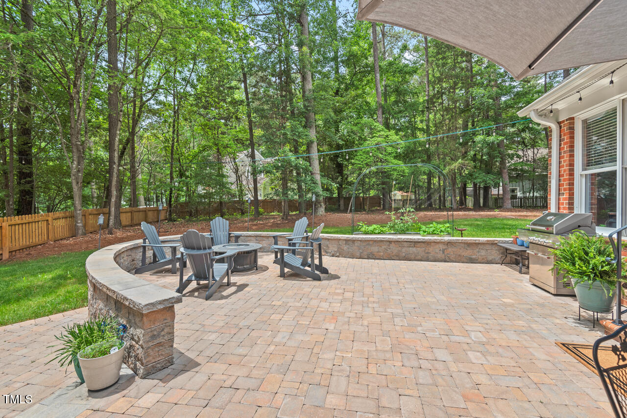9900 2 Robins Court Raleigh, NC 27613 - Photo 78 of 83 a view of a patio with chairs and a table