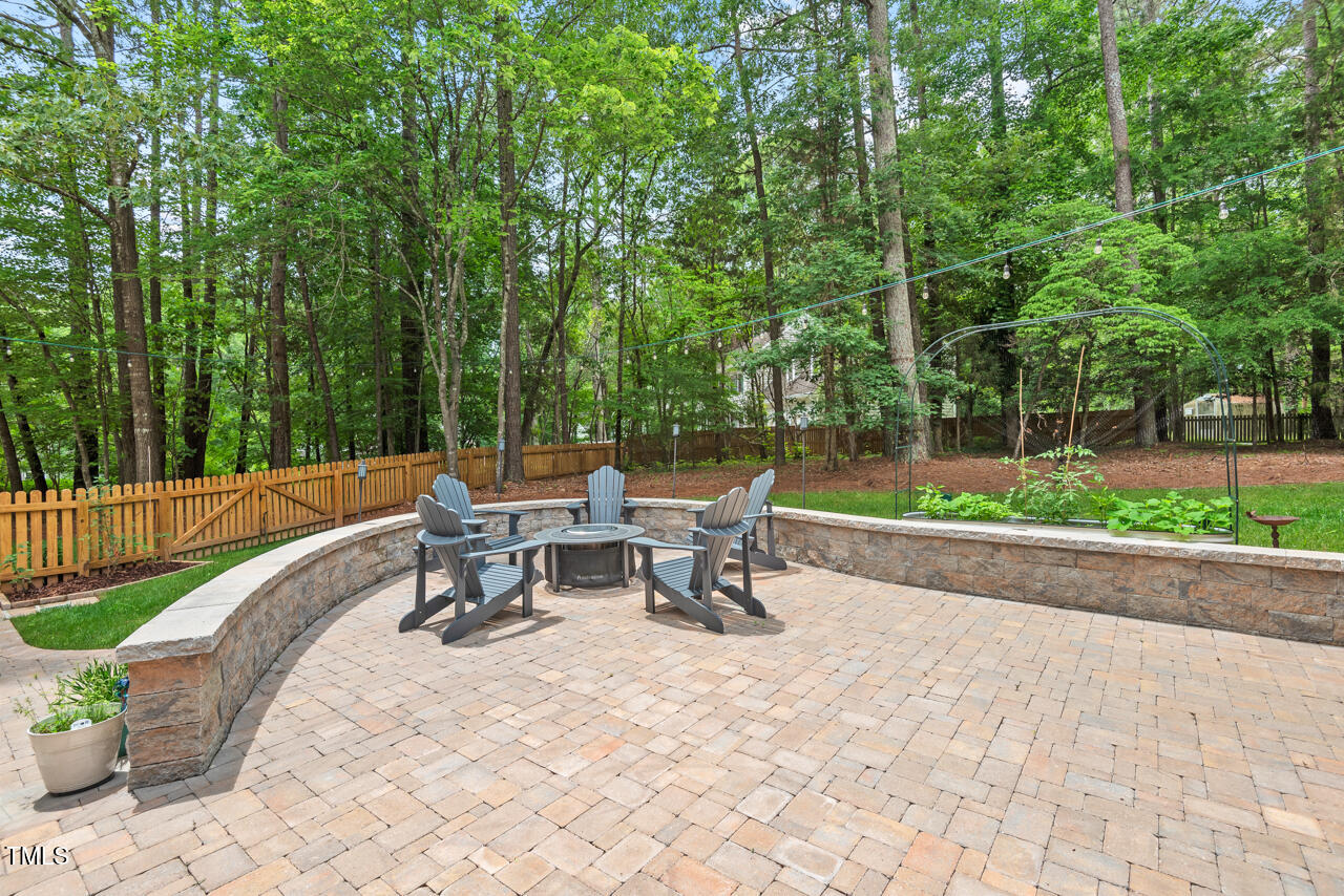 9900 2 Robins Court Raleigh, NC 27613 - Photo 79 of 83 a view of a patio with a table and chairs