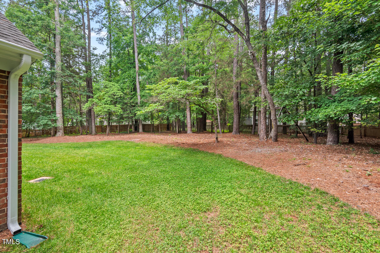 9900 2 Robins Court Raleigh, NC 27613 - Photo 83 of 83 a huge green field with lots of trees