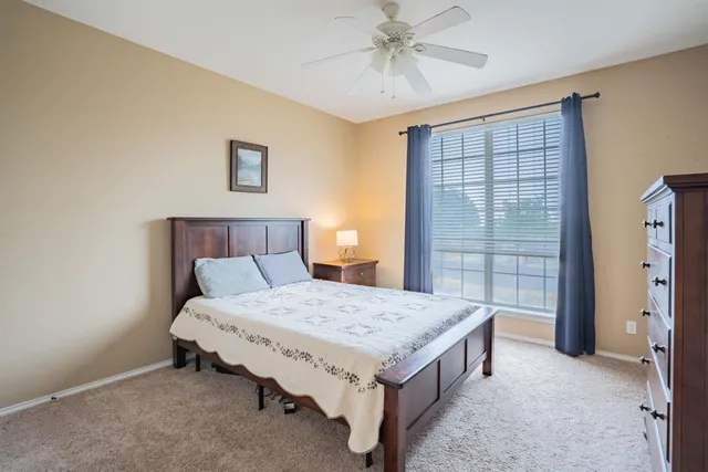 a bed room with a bed and a table