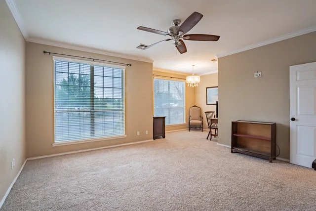 a view of room with workspace and windows