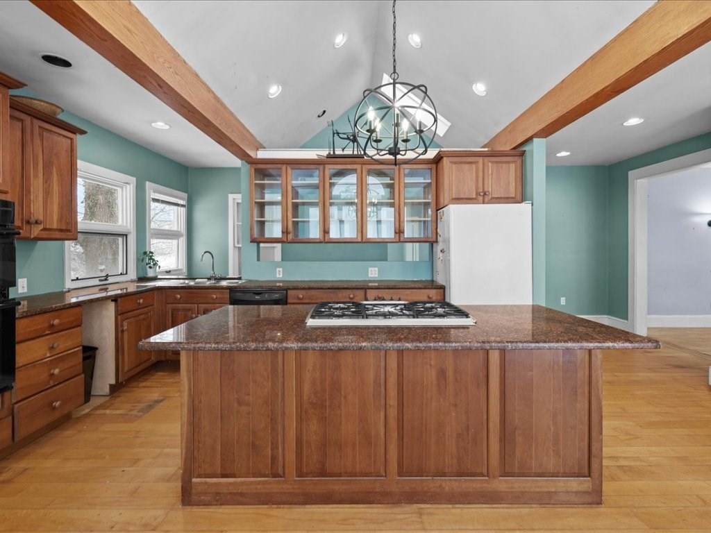207 Pleasant Street Milton, MA 02186 - Photo 13 of 28 a large kitchen with stainless steel appliances granite countertop a stove and a cabinets