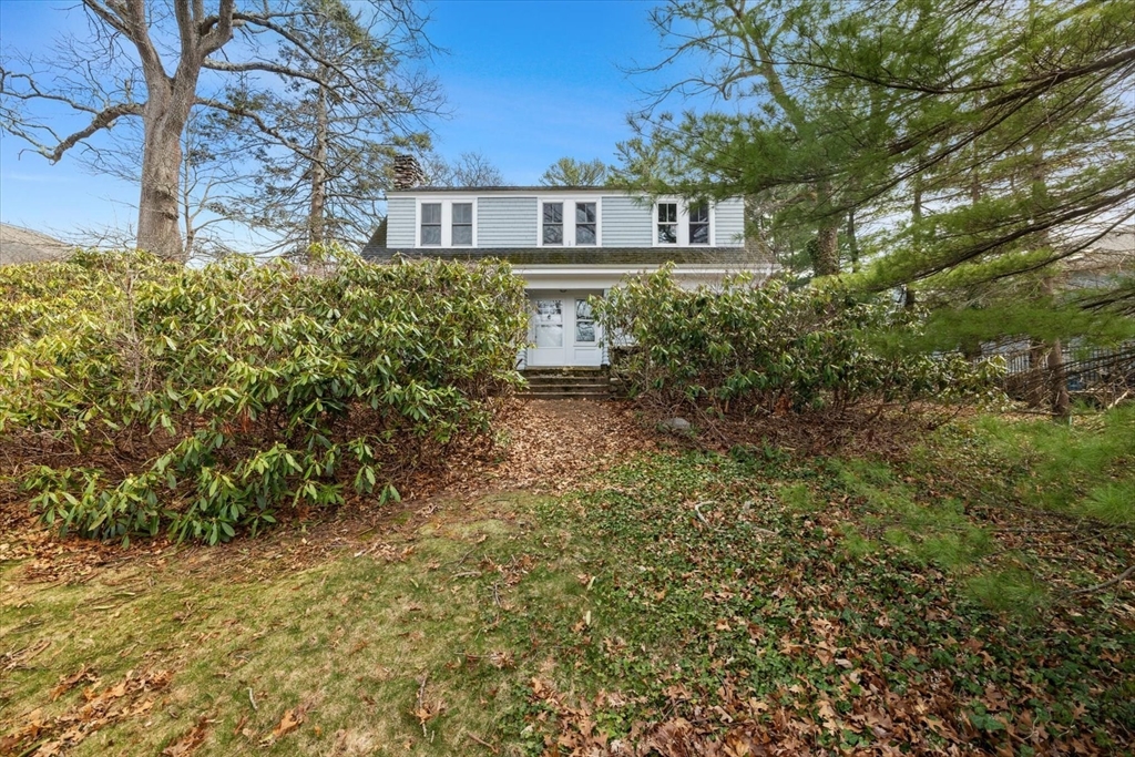 207 Pleasant Street Milton, MA 02186 - Photo 2 of 28 a front view of a house with garden