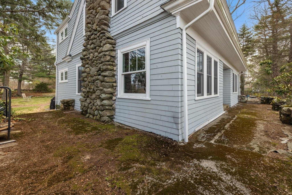 207 Pleasant Street Milton, MA 02186 - Photo 21 of 28 a view of a house with a yard