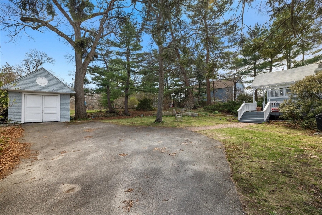 207 Pleasant Street Milton, MA 02186 - Photo 22 of 28 a view of a house with a yard