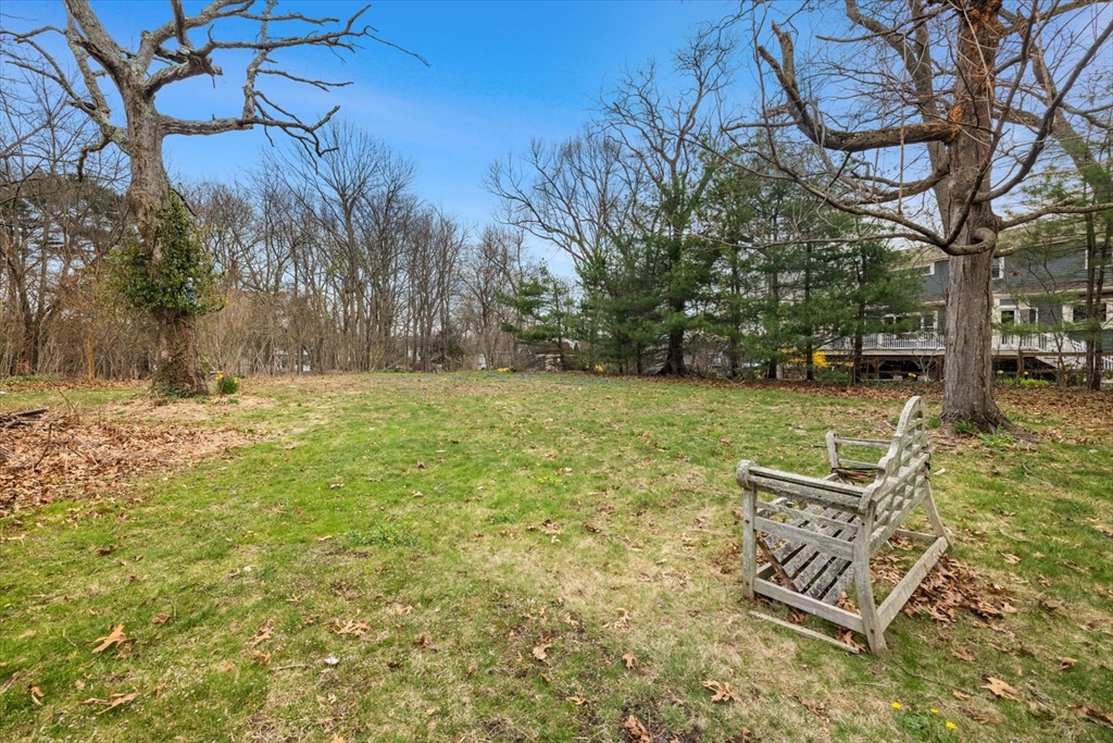 207 Pleasant Street Milton, MA 02186 - Photo 28 of 28 a view of a backyard with large trees