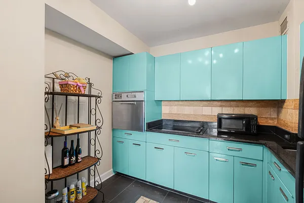 a kitchen with cabinets a sink and a stove