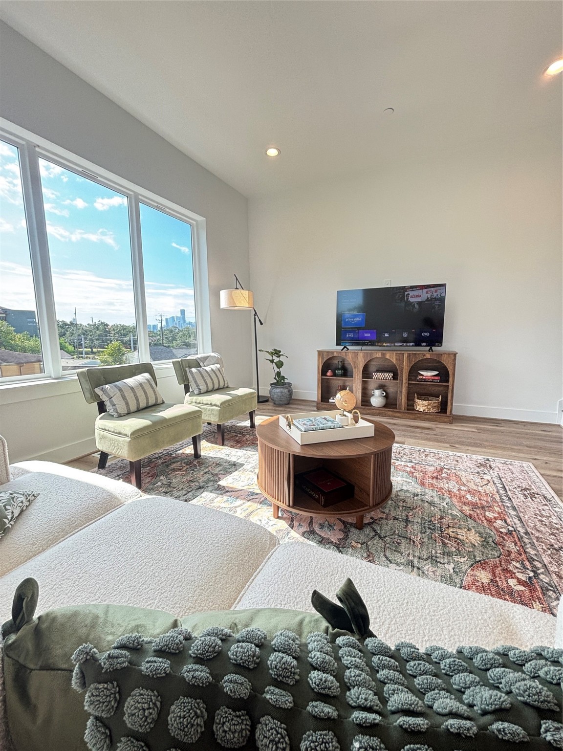 3824 Fulton Street, Unit 102 Houston, TX 77009 - Photo 2 of 16 a living room with furniture and a flat screen tv