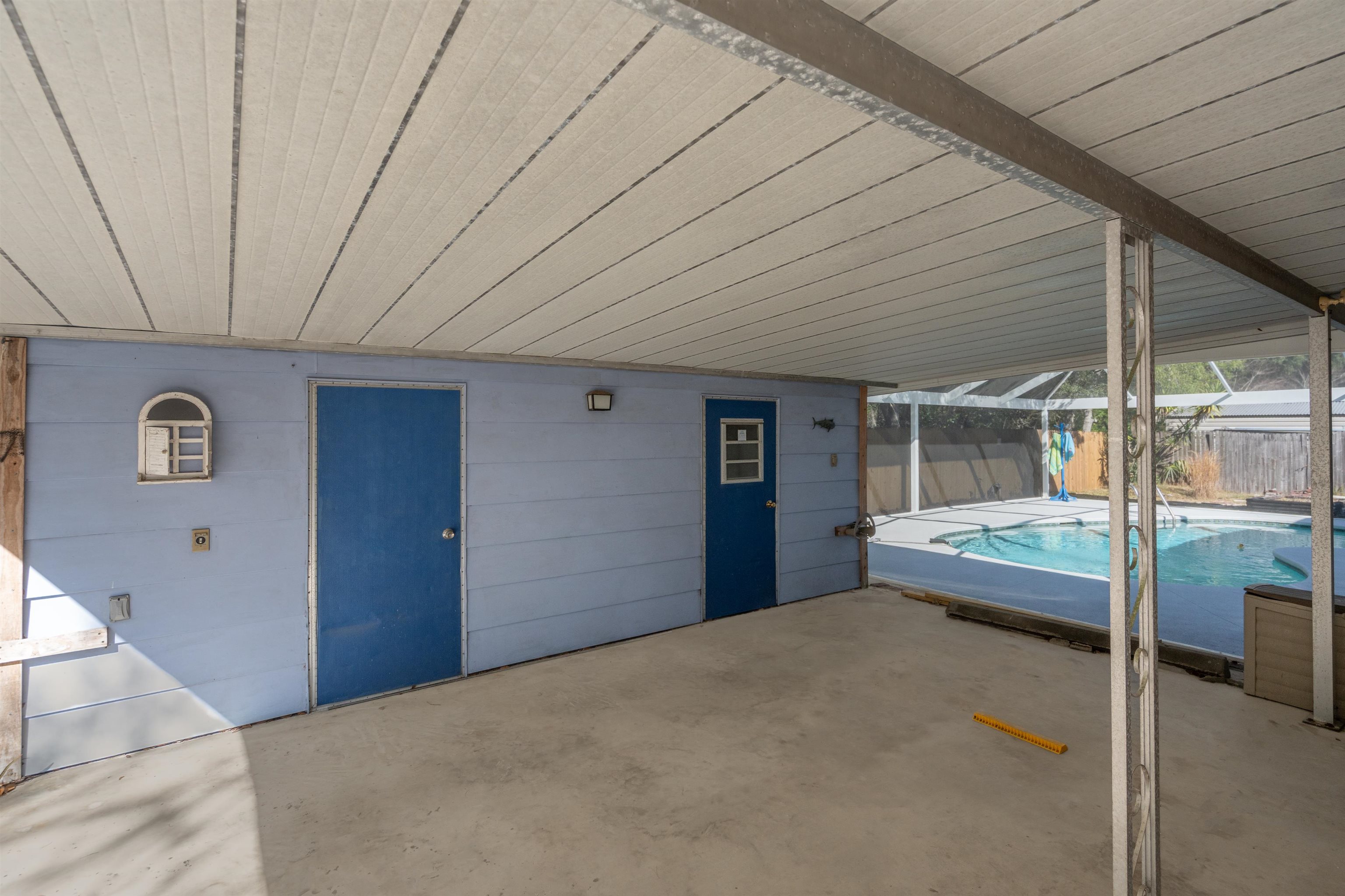 3979 Oak Terrace Road St. Augustine, FL 32086 - Photo 28 of 36 a bedroom with a bed and a large window