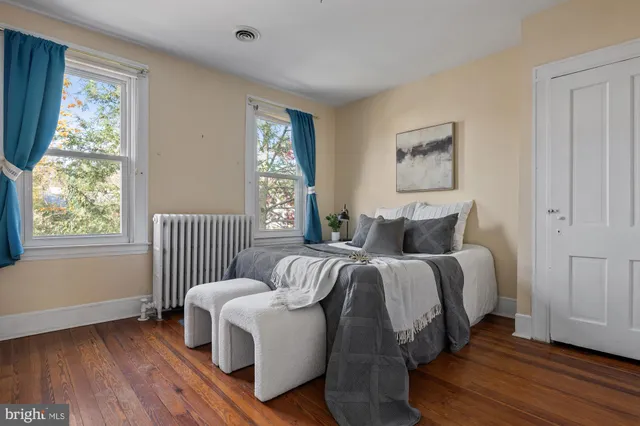 a bed room with a bed and a window