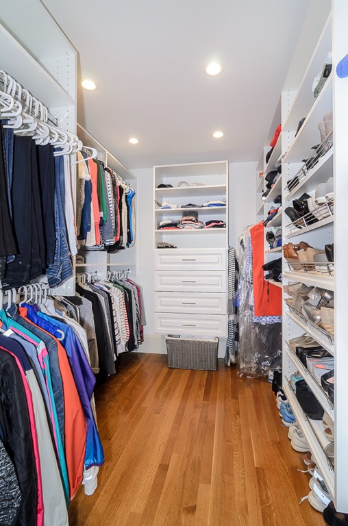82 Whittier Road Wellesley, MA 02481 - Photo 11 of 28 a view of walk in closet with clothes and shoes