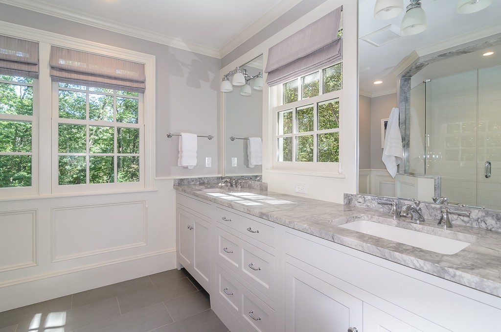 82 Whittier Road Wellesley, MA 02481 - Photo 12 of 28 a bathroom with a granite countertop sink and large window