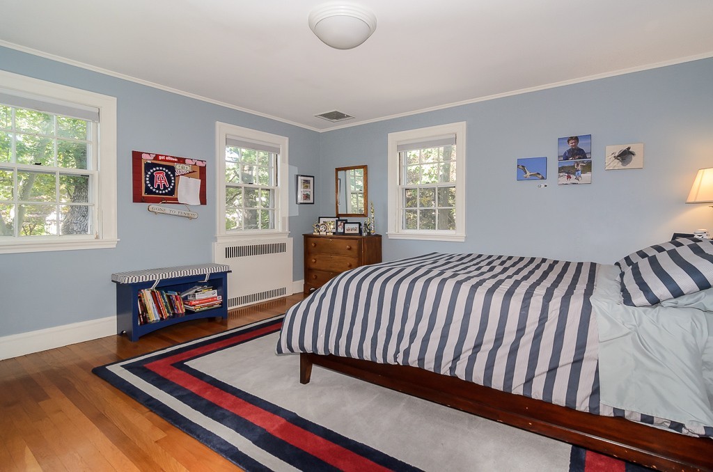 82 Whittier Road Wellesley, MA 02481 - Photo 14 of 28 a bedroom with furniture and a book shelf