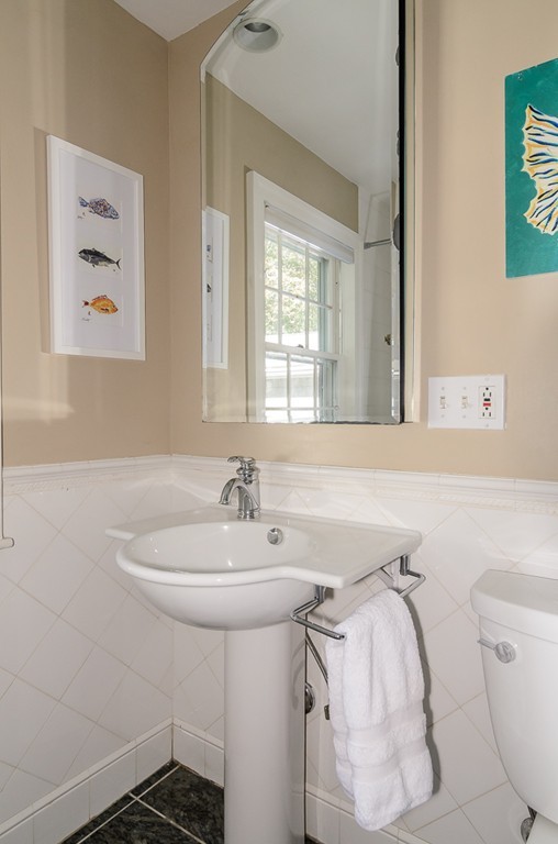 82 Whittier Road Wellesley, MA 02481 - Photo 19 of 28 a bathroom with a sink toilet and mirror