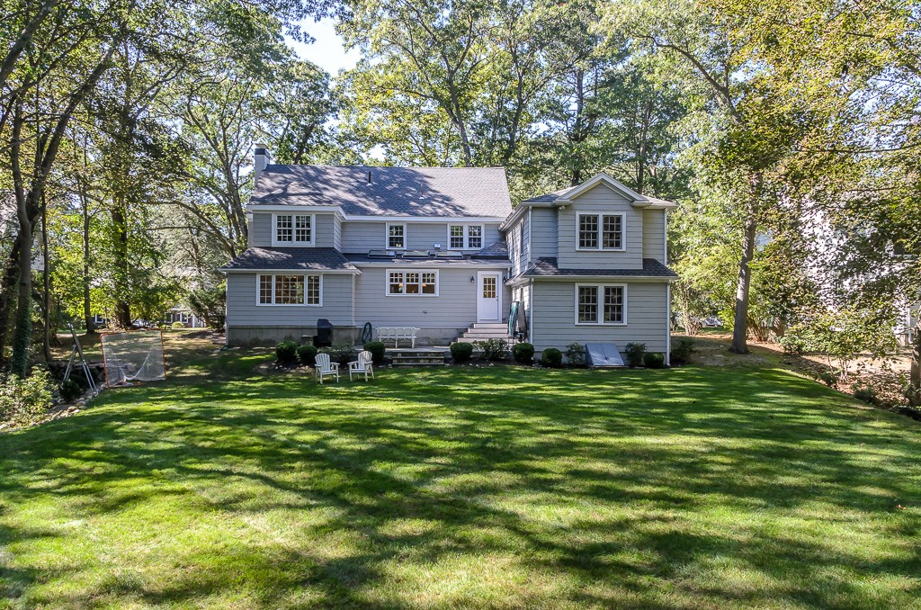 82 Whittier Road Wellesley, MA 02481 - Photo 24 of 28 a front view of a house with a garden