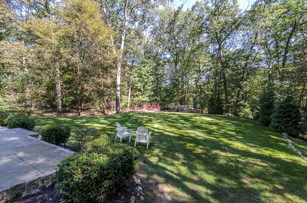 82 Whittier Road Wellesley, MA 02481 - Photo 26 of 28 a green field with lots of trees