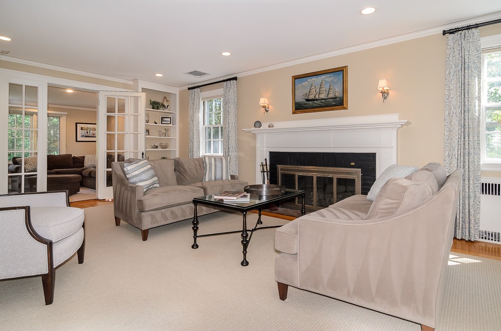 82 Whittier Road Wellesley, MA 02481 - Photo 3 of 28 a living room with furniture and a fireplace