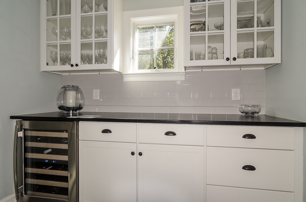 82 Whittier Road Wellesley, MA 02481 - Photo 7 of 28 a kitchen with a stove and white cabinets