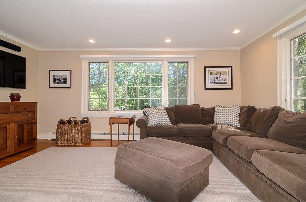82 Whittier Road Wellesley, MA 02481 - Photo 8 of 28 a living room with furniture and a flat screen tv
