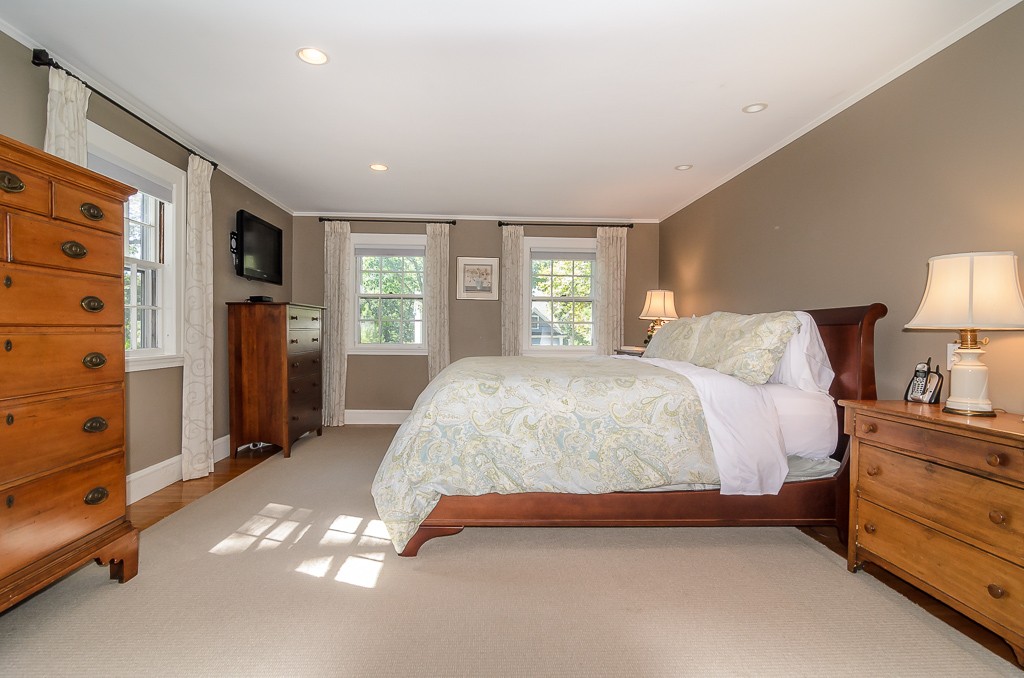 82 Whittier Road Wellesley, MA 02481 - Photo 9 of 28 a spacious bedroom with a bed and a dresser