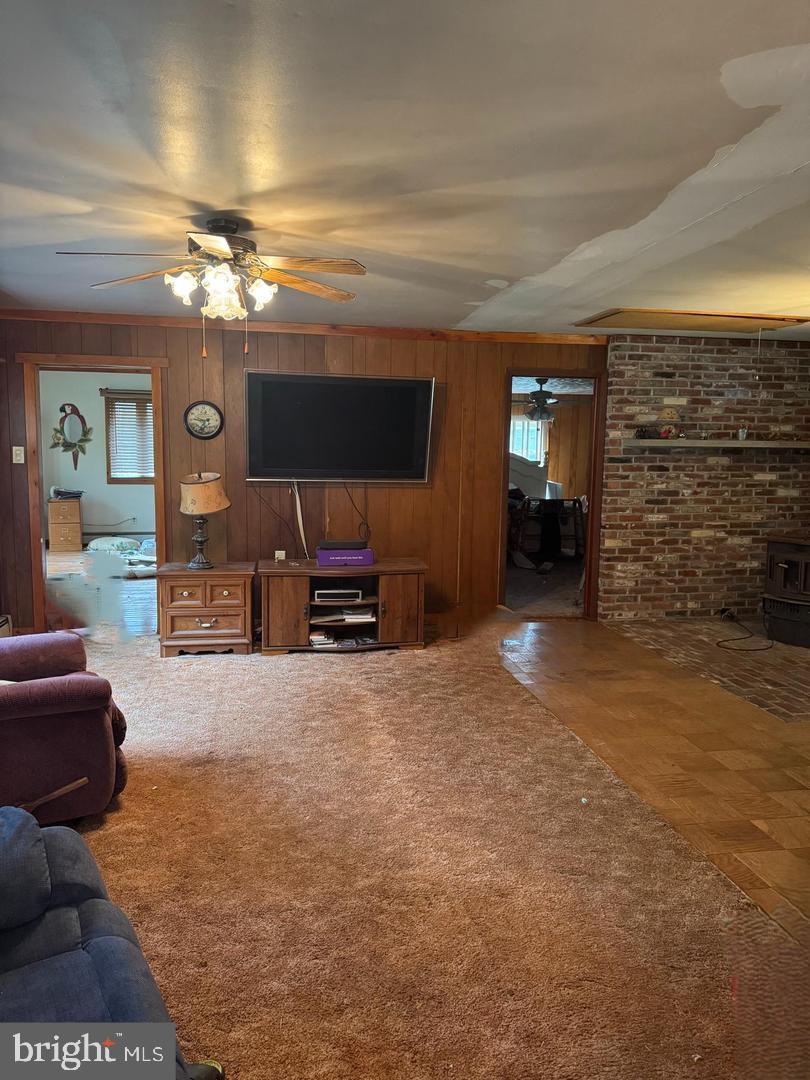 83 Station Road Leesburg, NJ 08327 - Photo 7 of 11 a view of a livingroom with furniture and a flat screen tv