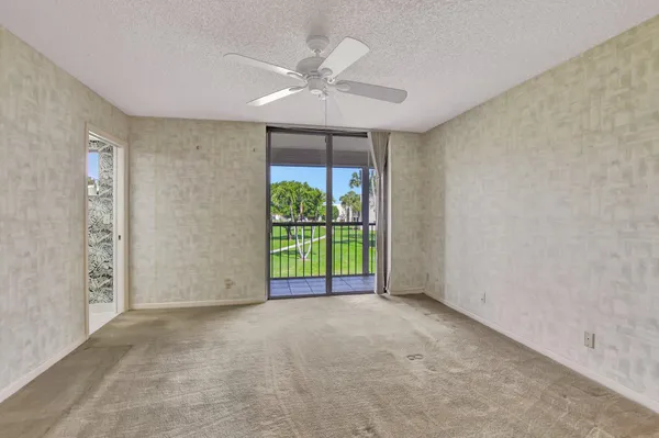 a view of an empty room with a window