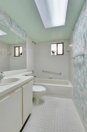 a bathroom with a sink a toilet and a bathtub