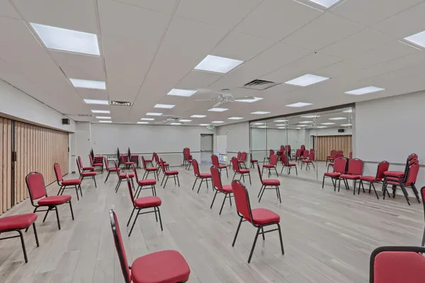 a view of a room with furniture and wooden floor