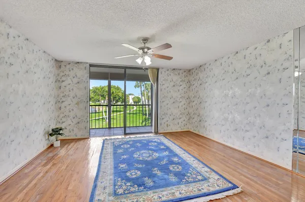 wooden floor in a room next to a window