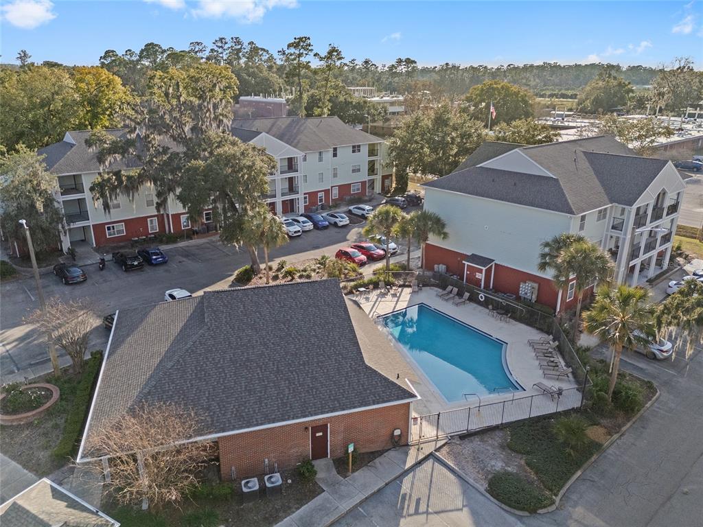 2360 Southwest Archer Road, Unit 607 Gainesville, FL 32608 - Photo 20 of 50 an aerial view of a house with a garden and lake view