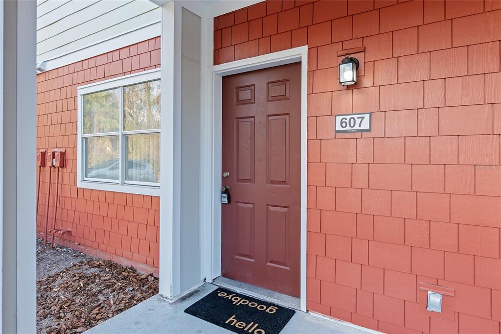 2360 Southwest Archer Road, Unit 607 Gainesville, FL 32608 - Photo 33 of 50 a view of a wooden door and a window