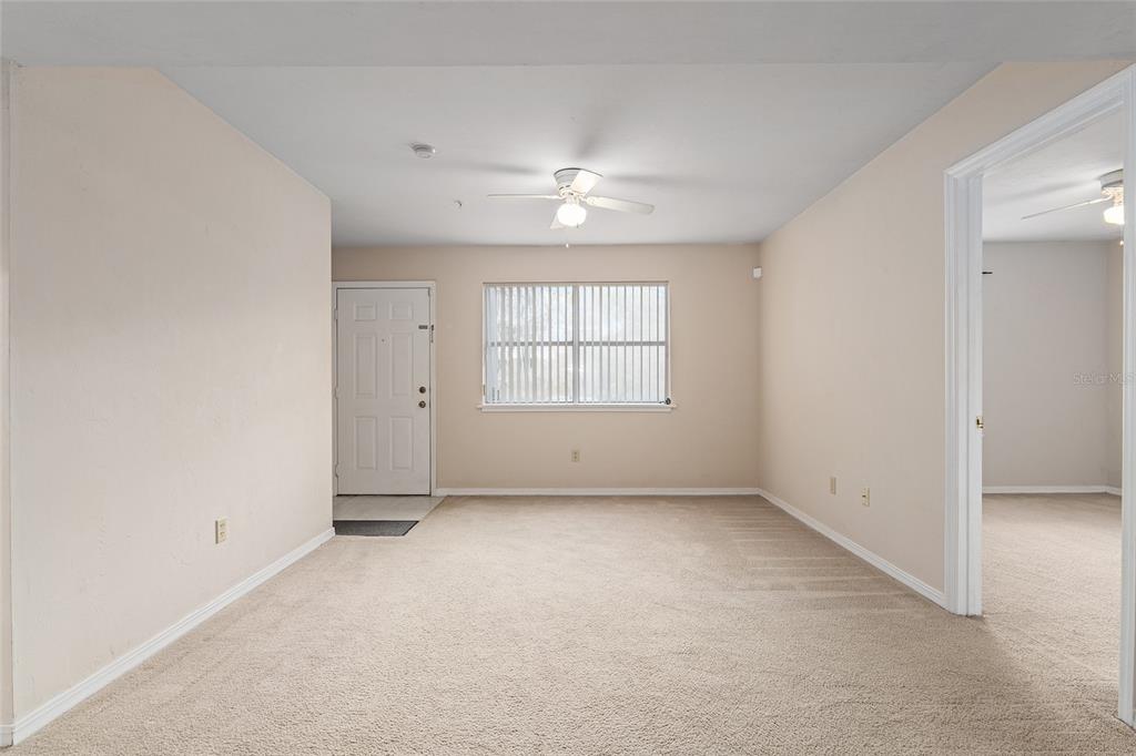 2360 Southwest Archer Road, Unit 607 Gainesville, FL 32608 - Photo 35 of 50 an empty room with a window and ceiling fan