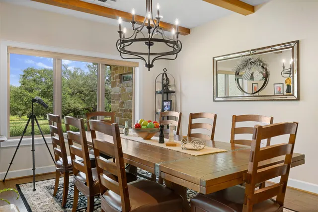 a view of a dining room with furniture window and outside view