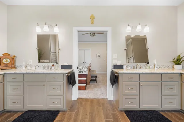 a spacious bathroom with a double vanity sink double and mirror