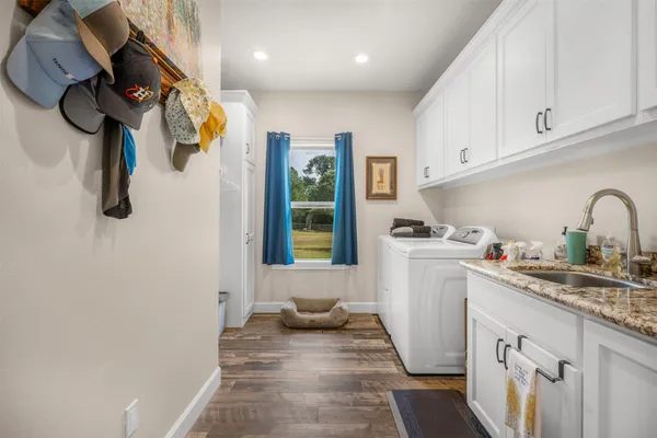 a kitchen with a refrigerator and a sink