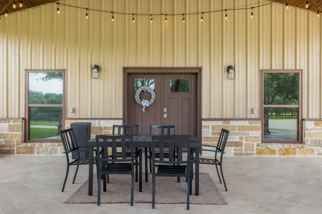 a view of a dining room with furniture and window