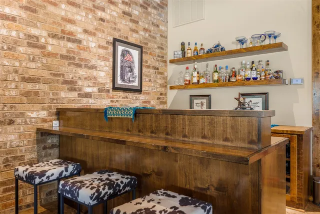 a bathroom with a sink a toilet and a shower