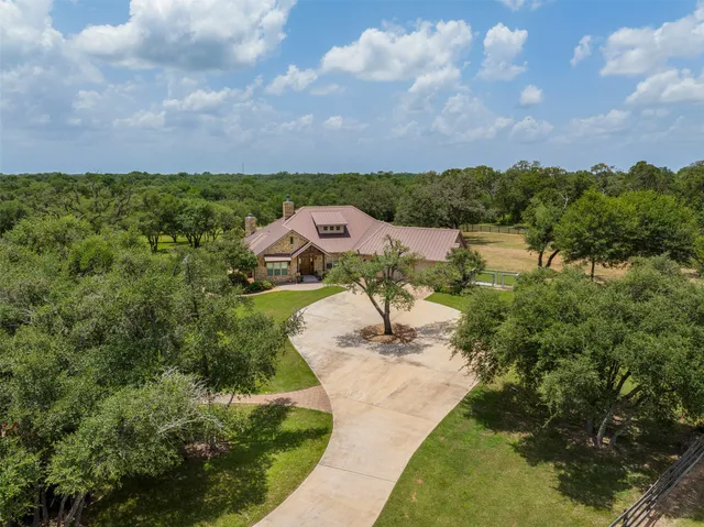 a view of a lake with houses in back