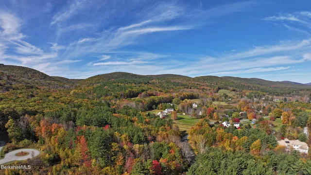 a view of a city with mountains in the background